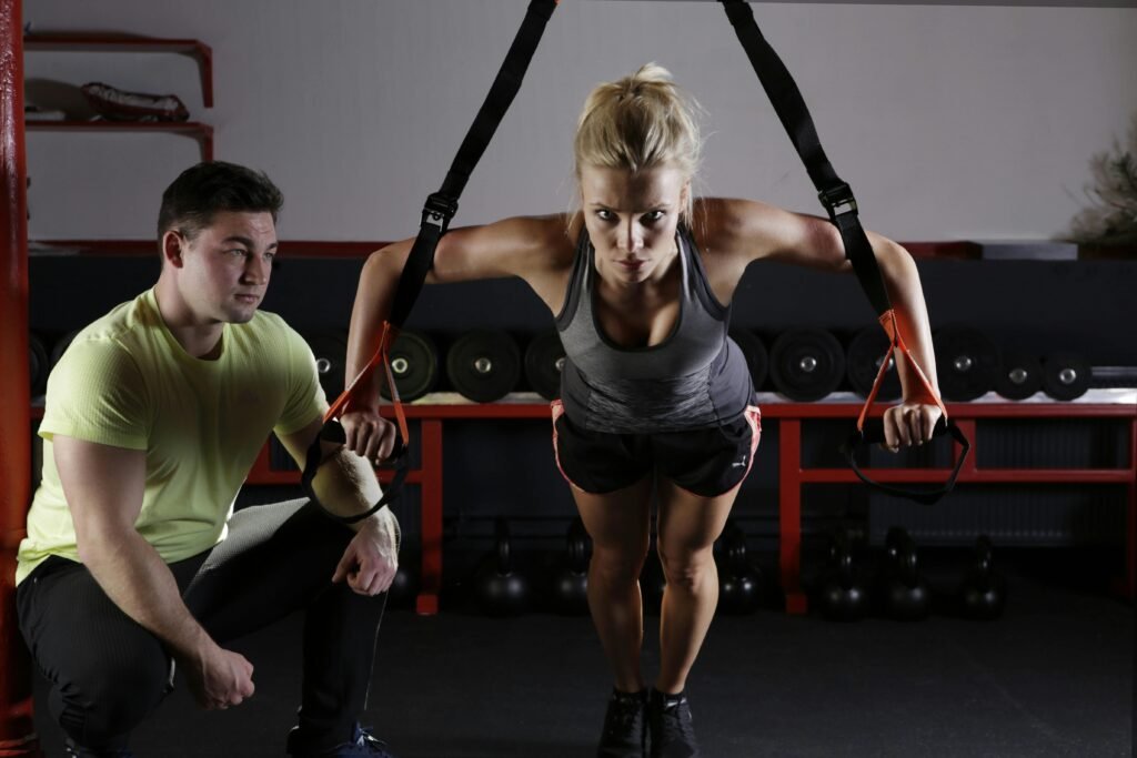 woman working with personal trainer