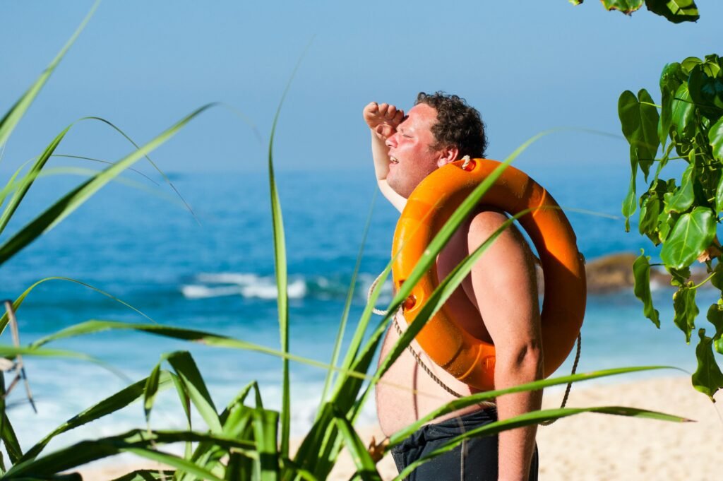 Man on beach with sunburn