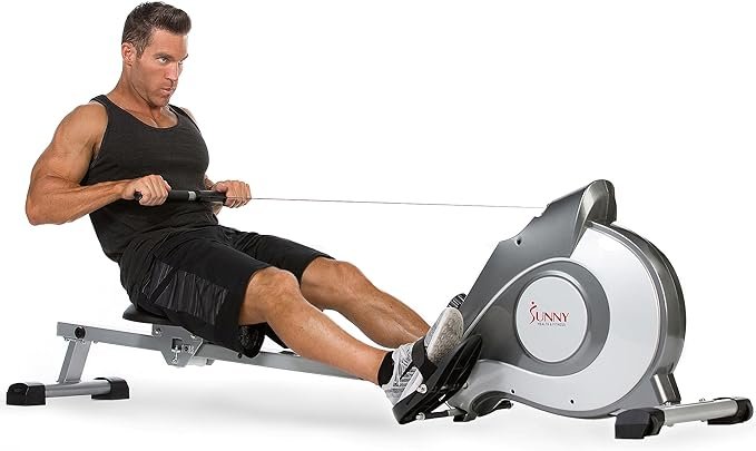 Man using rowing machine for weight loss