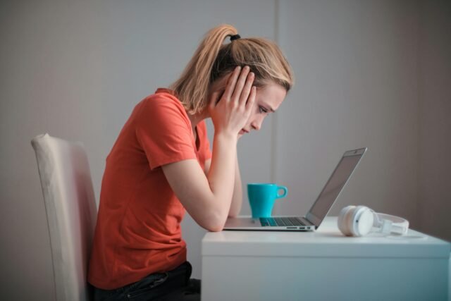 Woman stressed at work in front of computer