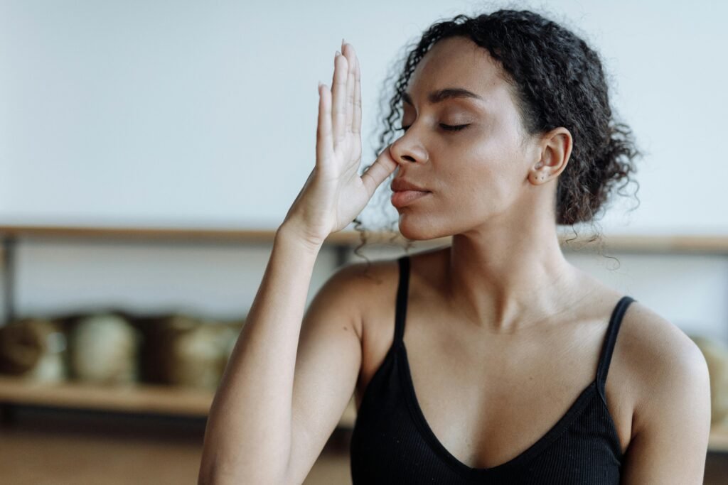 Woman doing alternate nostril breathing